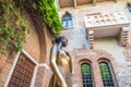 Bronze statue of Juliet and balcony by Juliet house, Verona in Italy Royalty Free Stock Photo