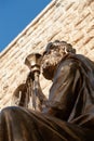 Bronze statue of King David playing the harp outside his tomb in the Old City of Jerusalem, Israel Royalty Free Stock Photo