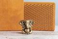 Bronze statue of Lord Ganesha. Brown Sadhu wooden boards with nails for yoga practices on the grey background