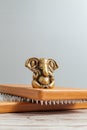 Bronze statue of Lord Ganesha. Brown Sadhu wooden boards with nails for yoga practices on the grey background