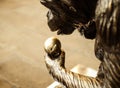 Bronze statue of a monkey eating an apple. London, England, UK.