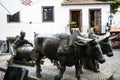 Bronze Statue of Oxen and their Driver pulling goods on wooden runners. The statue is in Funchal Madeira near the Market Hall Royalty Free Stock Photo