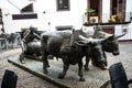 Bronze Statue of Oxen and their Driver pulling goods on wooden runners. The statue is in Funchal Madeira near the Market Hall Royalty Free Stock Photo