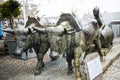 Bronze Statue of Oxen and their Driver pulling goods on wooden runners. The statue is in Funchal Madeira near the Market Hall Royalty Free Stock Photo