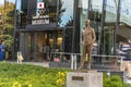 Bronze statue of Pierre de Coubertin in front of the Olympic Rings monument of the Japan Olympic Museum