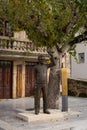 Bronze statue of Portuguese musician artist Zeca Afonso with a carnation flower on the hand in Belmonte, Portugal