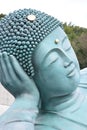 The bronze statue of reclining Buddha statue at Nanzoin Temple in Sasaguri, Fukuoka, Japan. Royalty Free Stock Photo