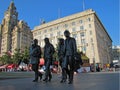 Bronze statue representing The Beatles walking along the street in Liverpool