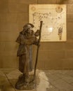 Bronze statue of Saint James with his pilgrim`s hat with a scallop on the front brim in Poble Espanyol, Barcelona.