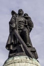 Bronze statue that symbolizes a Russian soldier who protects a child, destroying with a sword the nazi swastika, Treptower Park,