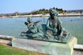 Bronze statue of three cherubs on the edge of a basin of the Bassin du Midi in the gardens of Versailles, in front of the west Royalty Free Stock Photo