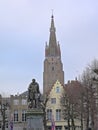 Simon Stevin statue in front of  the church of our Lady in the winter evening sun in Bruges Royalty Free Stock Photo