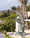 Bronze statue of two dolphins