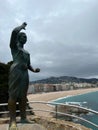 Bronze statue at a viewpoint overlooking the ocean