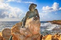 Bronze statue of woman called `Sol Alter` on a stone, Paphos, Cy