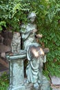 The bronze statue of a woman with cat and bird in the park of Batumi, Georgia Royalty Free Stock Photo