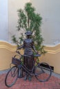Bronze statue with a woman next to a bicycle