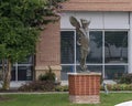 Bronze statue of a young female with angel wings outside the Methodist Richardson Cancer Center in Texas.