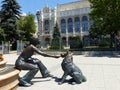 Bronze statues of a girl that plays with a dog to Budapest in Hungary.