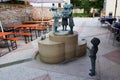 Bronze statues and restaurant Royalty Free Stock Photo