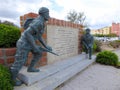 Bronze statues of soldiers at war memorial