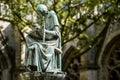 Bronze statuette of Hugo Wstinc writing, Dom church, Utrecht