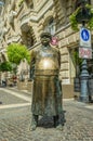 Bronze street statue of a policeman on a street in Budapest, Hungary