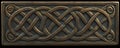A bronze textured surface with intricate, Celtic knotwork patterns engraved into the metal, adding Royalty Free Stock Photo