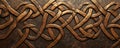 A bronze textured surface with intricate, Celtic knotwork patterns engraved into the metal, adding Royalty Free Stock Photo