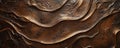 A bronze textured surface with a smooth, polished finish, accented by subtle, swirling patterns Royalty Free Stock Photo