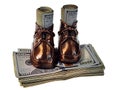 Bronzed Baby Shoes with a stack of Money