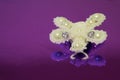Brooch butterfly handmade from white beads, white artificial pearls and two zircons. Front view