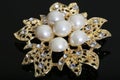 Brooch with gold flowers and pearl