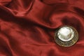 Brooch with zircon on red silk