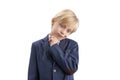 Brooding schoolboy is isolated on white background. Boy in school uniform thinks about something