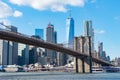 The Brooklyn Bridge with an American Flag over the East River with the Lower Manhattan New York City Skyline Royalty Free Stock Photo