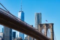 The Brooklyn Bridge with an American Flag over the East River with the Lower Manhattan New York City Skyline Royalty Free Stock Photo
