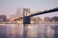 Brooklyn Bridge at a foggy night, New York City, USA Royalty Free Stock Photo