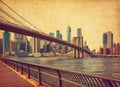 The Brooklyn Bridge with Lower Manhattan in the background at  the day-time, New York City, United States. Photo in retro style. A Royalty Free Stock Photo