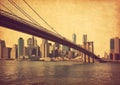 Brooklyn Bridge and Lower Manhattan in New York City, United States. Photo in retro style. Added paper texture