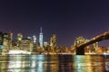 Brooklyn bridge and manhattan waterfront at night Royalty Free Stock Photo