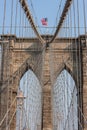 Brooklyn Bridge at New York City with American flag
