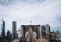 Brooklyn Bridge in New York City, USA with an American flag on top Royalty Free Stock Photo