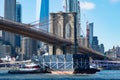 The Brooklyn Bridge over the East River with a Shipping Boat in New York City
