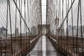 Brooklyn bridge rainy day. Close Up view of Brooklyn bridge in New York City. Royalty Free Stock Photo