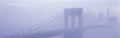 Brooklyn Bridge surrounded by fog