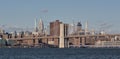 brooklyn bridge view over hudson river with nyc skyline background (urban cityscape of manhattan) Royalty Free Stock Photo