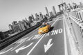 Brooklyn bridge with yellow fast taxi car on New York city NYC Royalty Free Stock Photo