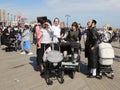 Jewish orthodox family enjoy outdoors during Passover at Coney Island in Brooklyn, New York