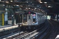 NYC Subway F Train arrives at West 8 Street Station in Brooklyn Royalty Free Stock Photo